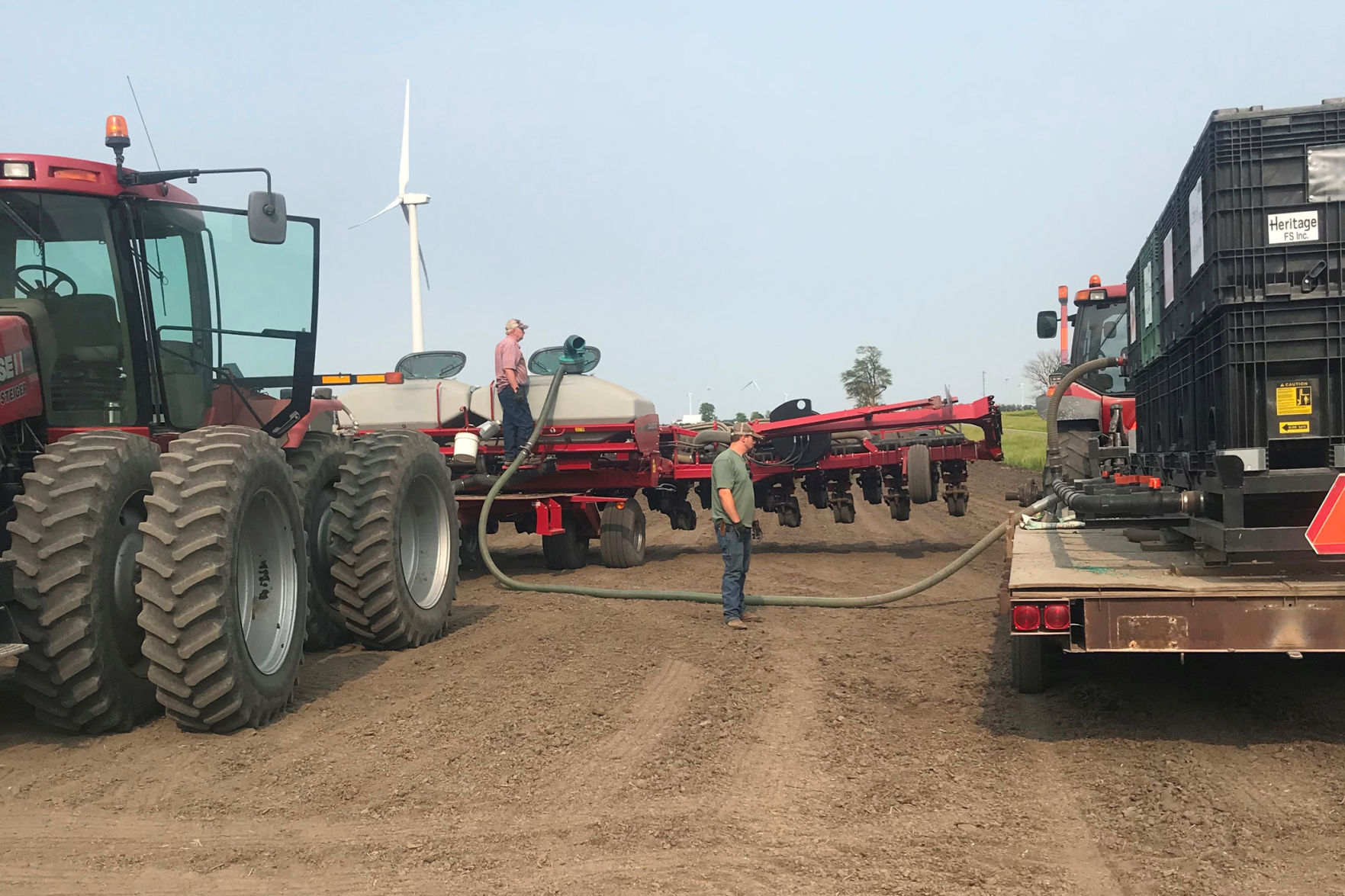 1005-Bob & Mike loading planter.jpg
